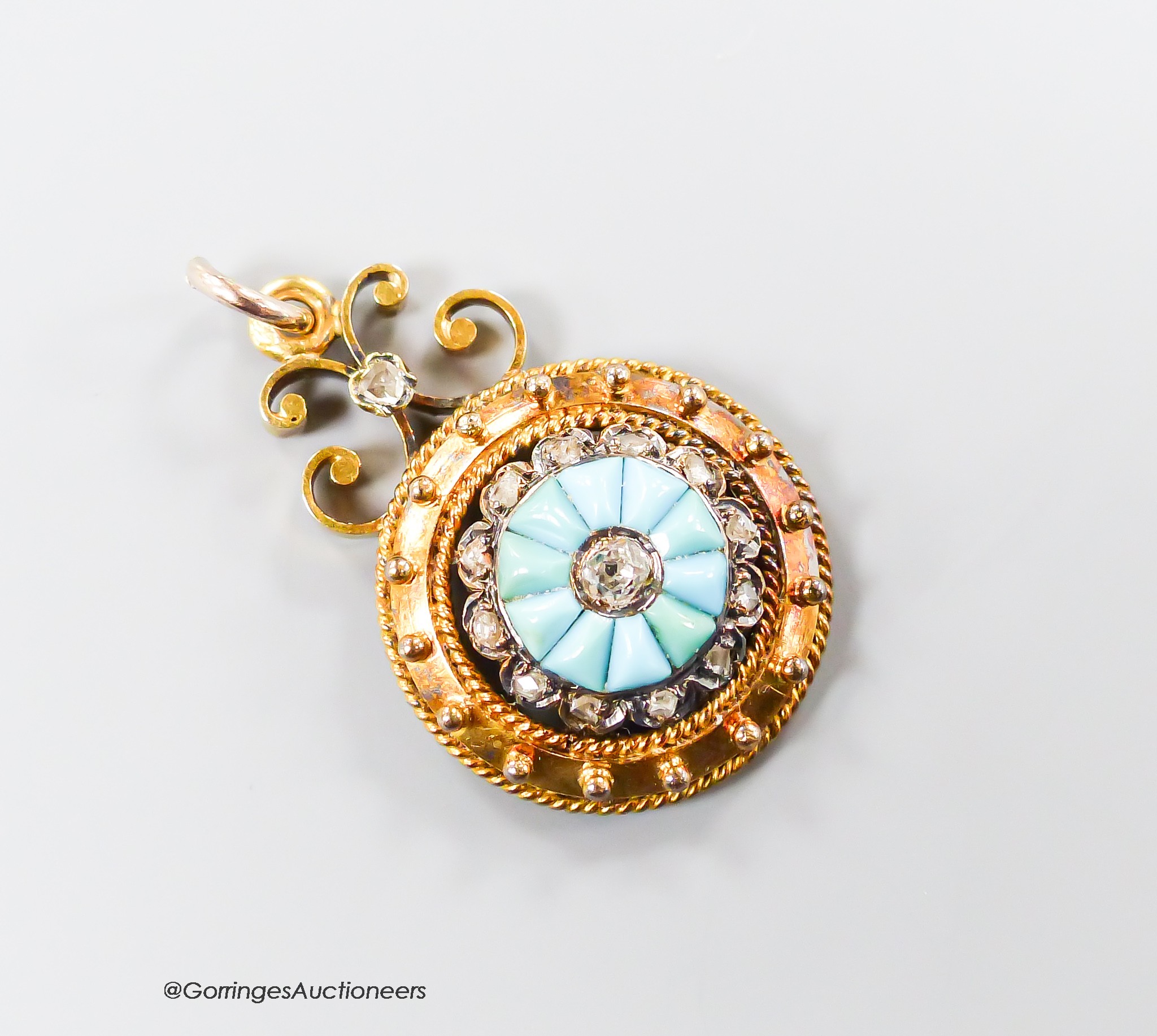 A Victorian yellow metal, turquoise and rose cut diamond set 'wheel' pendant, 16mm, gross weight 3.9 grams.